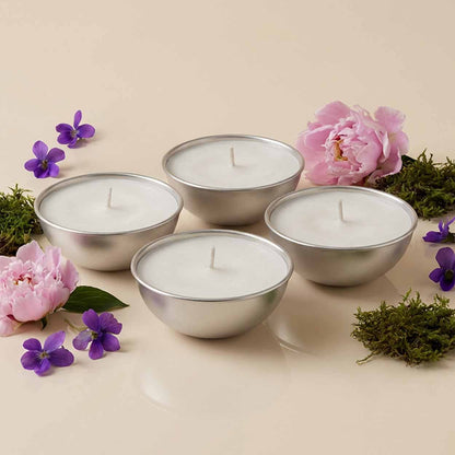 Set da 4 ricariche candela Aura Effusione formato L fragranza Oasi Zegna in alluminio con note fruttate e ambrate.