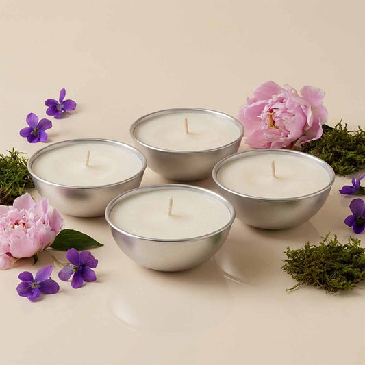 Set da 4 ricariche candela Aura Effusione formato L fragranza Oasi Zegna in alluminio con note fruttate e ambrate.