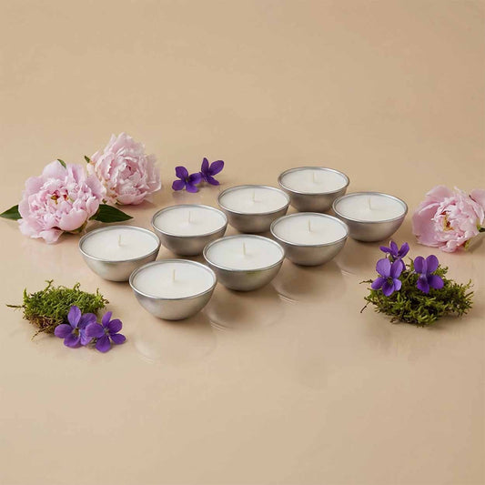 Set da 8 ricariche candela Aura Effusione formato S fragranza Oasi Zegna in alluminio con note fruttate e ambrate.